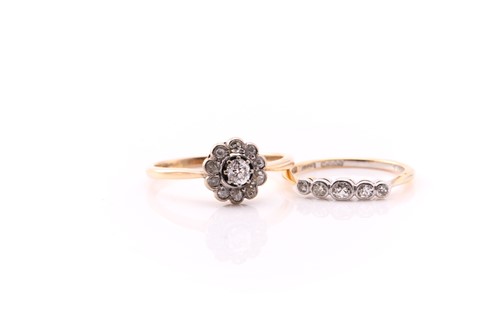 Lot 676 - A seven stone diamond cluster ring; the old...