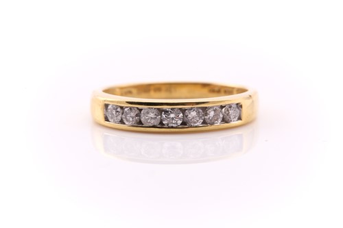 Lot 752 - A diamond half hoop eternity ring; the seven...