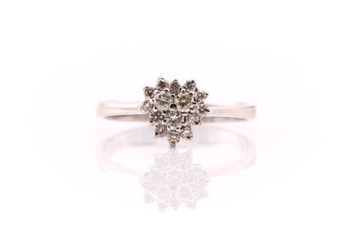 Lot 607 - A heart-shaped diamond cluster ring, the three...