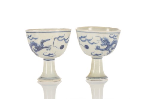 Lot 201 - A pair of Chinese blue & white stem cups, Ming...