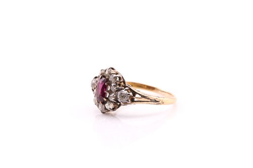 Lot 135 - A late Victorian ruby and diamond cluster ring;...