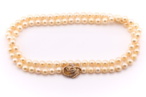 Lot 302 - A pearl and diamond necklace; the single row...