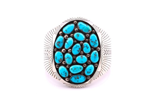 Lot 258 - A native American turquoise and white metal...