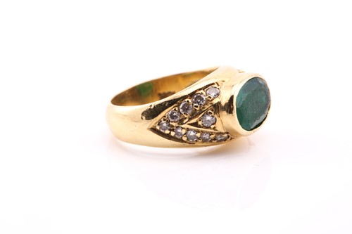 Lot 78 - An emerald and diamond ring, in yellow metal...