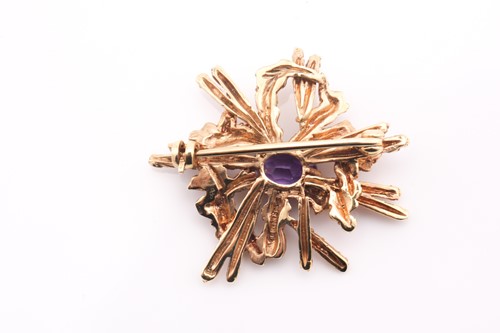 Lot 97 - An amethyst abstract brooch, 1970s, the...