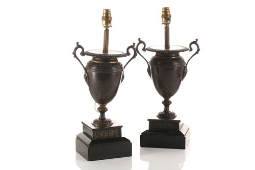 Lot 317 - A pair of patinated bronze two handle urn form...