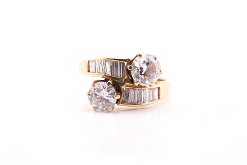 Lot 262 - A yellow metal stamped 18ct diamond set ring,...
