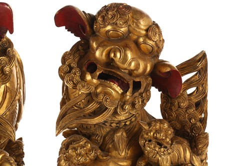 Lot 121 - A pair of Chinese carved and gilded wood...