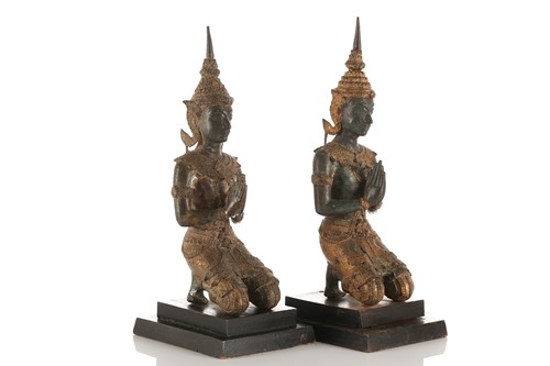 Lot 214 - A near pair of Thai parcel gilt bronze Buddhas,...