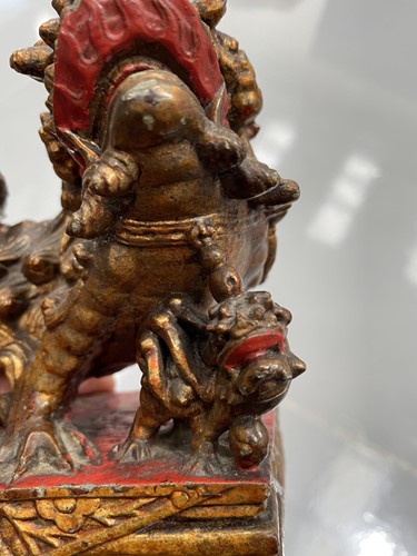 Lot 156 - A large carved and gilded wood temple lion,...