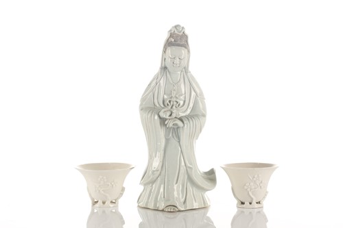 Lot 193 - A Chinese Dehua blanc de chine figure of...