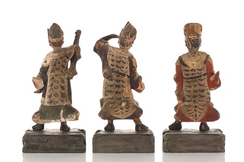 Lot 197 - Three Chinese carved wood and polychrome...