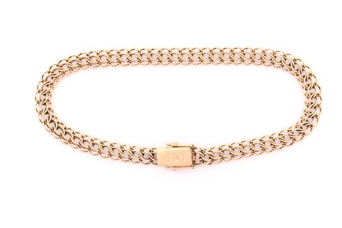 Lot 250 - A 14carat fancy curb link bracelet, the clasp...