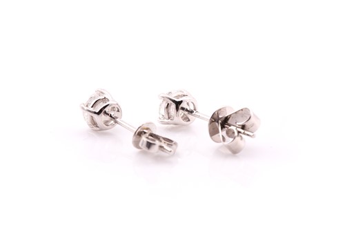 Lot 85 - A pair of diamond set stud earrings, in white...