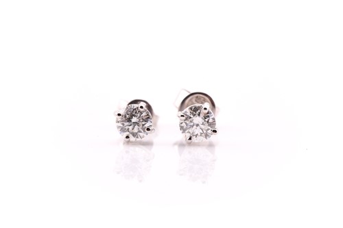 Lot 85 - A pair of diamond set stud earrings, in white...