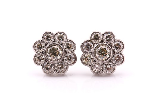 Lot 145 - A pair of diamond cluster earrings, each...