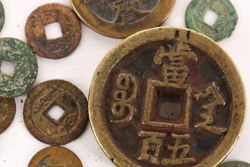 Lot 154 - A collection of sixty Chinese coins, Qing...