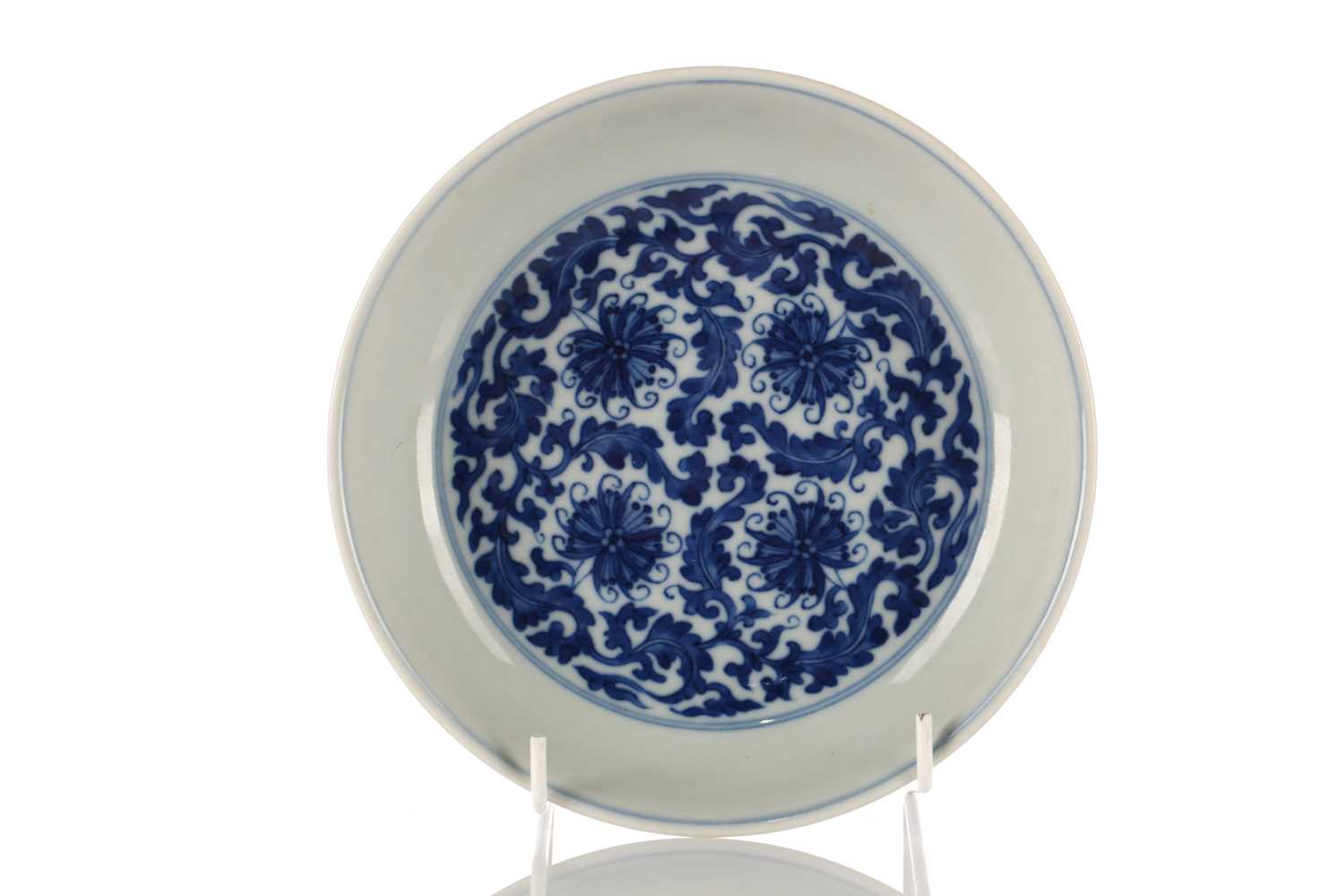 Lot 135 - A Chinese blue & white lotus dish, Qing, the...