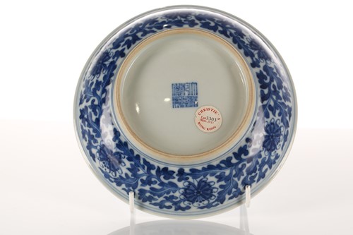 Lot 135 - A Chinese blue & white lotus dish, Qing, the...