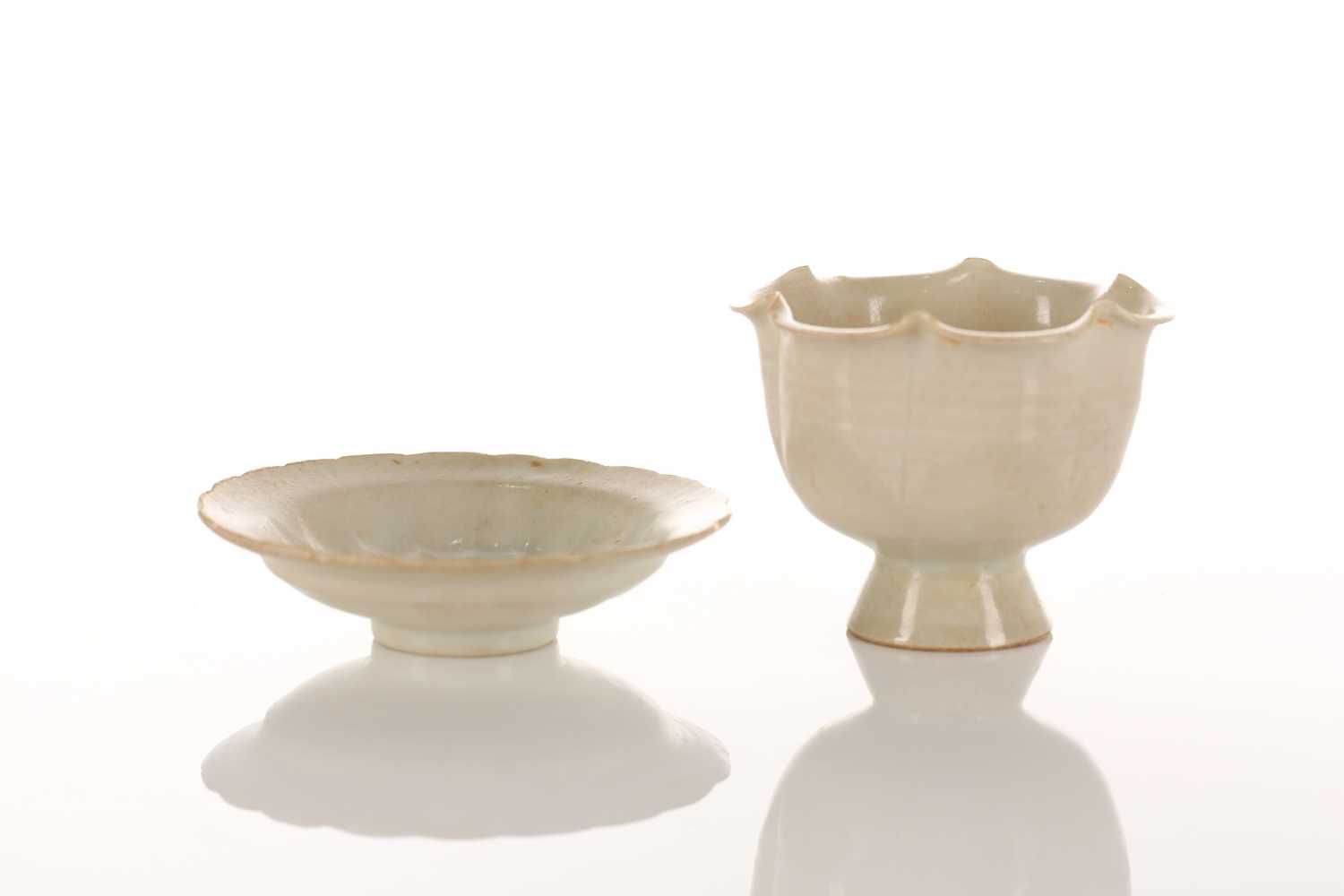 Lot 173 - A Chinese Qingbai stem cup and corresponding...