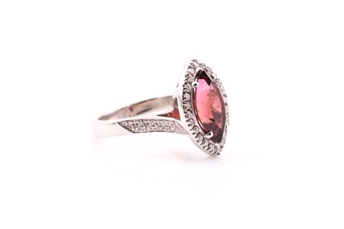 Lot 70 - A tourmaline and diamond cluster ring; the...