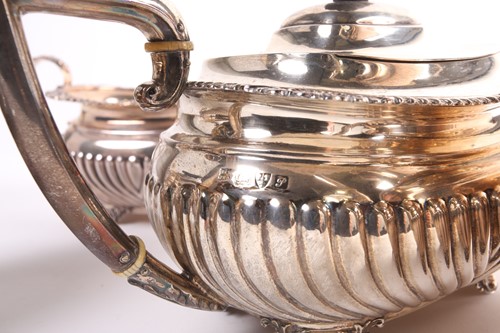 Lot 331 - A silver four piece tea service, of boat form,...