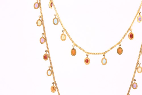 Lot 206 - A three strand multi-gem necklace, the long...