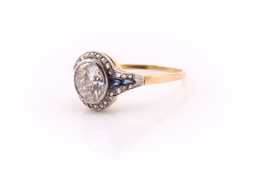 Lot 201 - A yellow and white metal halo ring, set with a...