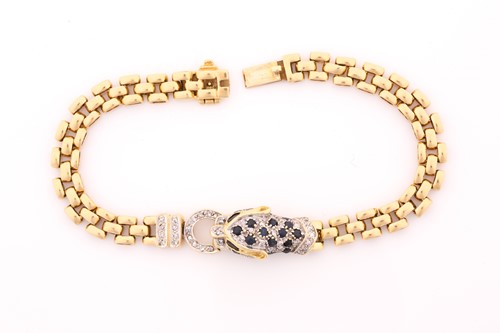 Lot 106 - A diamond and sapphire panther head bracelet,...