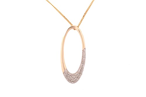 Lot 27 - A 9ct yellow gold oval pendant on chain, the...