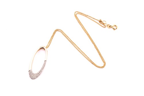 Lot 27 - A 9ct yellow gold oval pendant on chain, the...