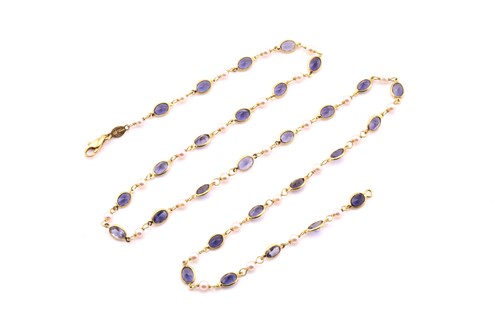 Lot 189 - An iolite and pearl long chain, with twenty...