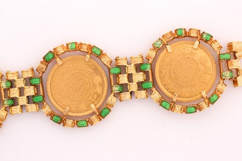 Lot 284 - A yellow metal, enamel and coin-set bracelet....