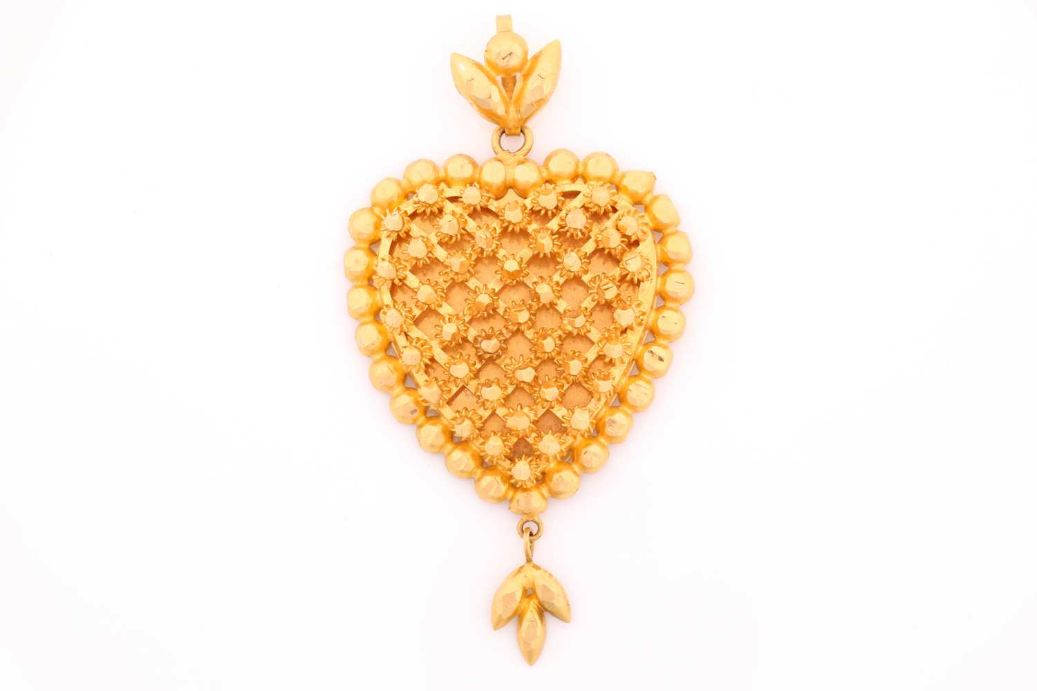 Lot 76 - A Middle Eastern yellow metal heart-shaped...