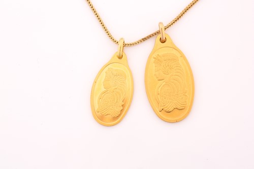 Lot 160 - Two Suisse oval graduated pendants cast with...