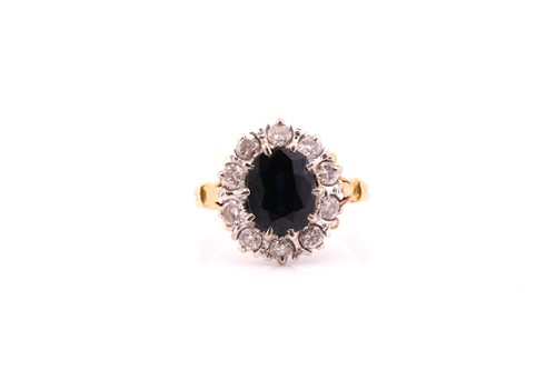 Lot 230 - An 18ct yellow and white gold sapphire and...