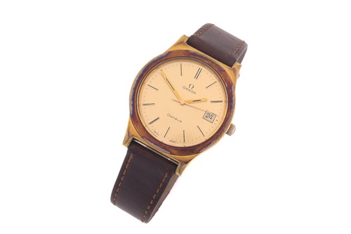 Lot 879 - A hand-wound Omega Geneve with a gold plated...