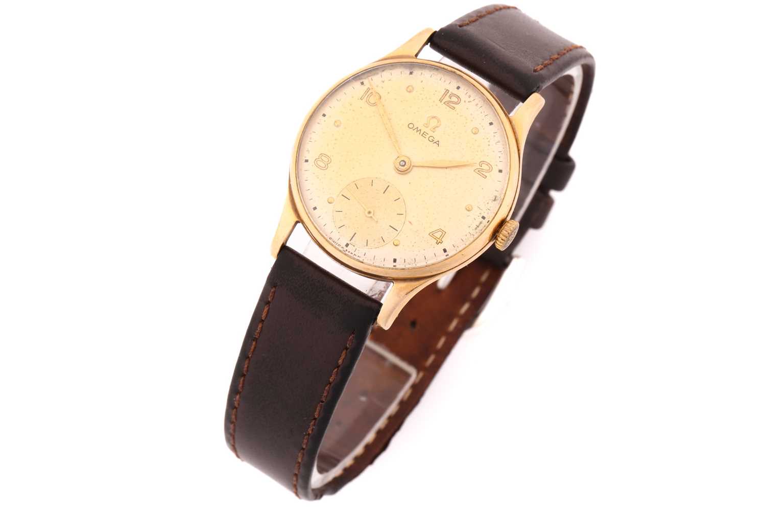 Lot 880 - A hand-wound vintage Omega with a 9ct yellow...