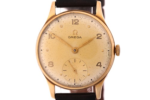 Lot 880 - A hand-wound vintage Omega with a 9ct yellow...