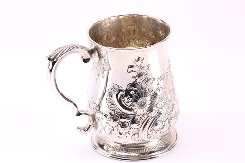 Lot 577 - A George III silver mug, with double scroll...