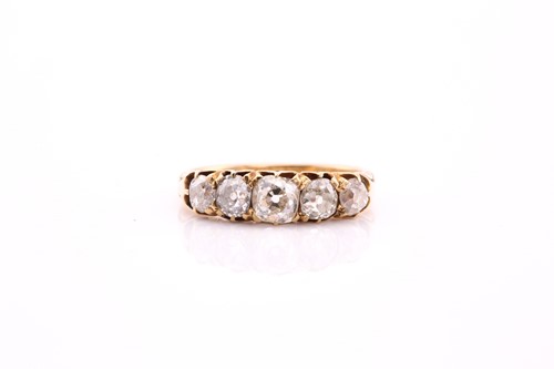 Lot 10 - A five stone half hoop diamond ring; the...