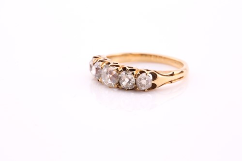 Lot 10 - A five stone half hoop diamond ring; the...