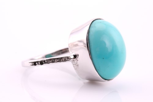 Lot 49 - A turquoise and diamond ring, the oval...