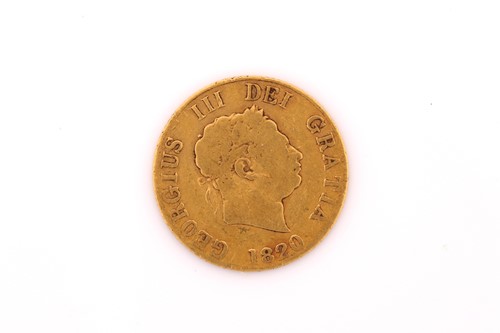 Lot 478 - A George III half guinea, dated 1820. 3.9 grams