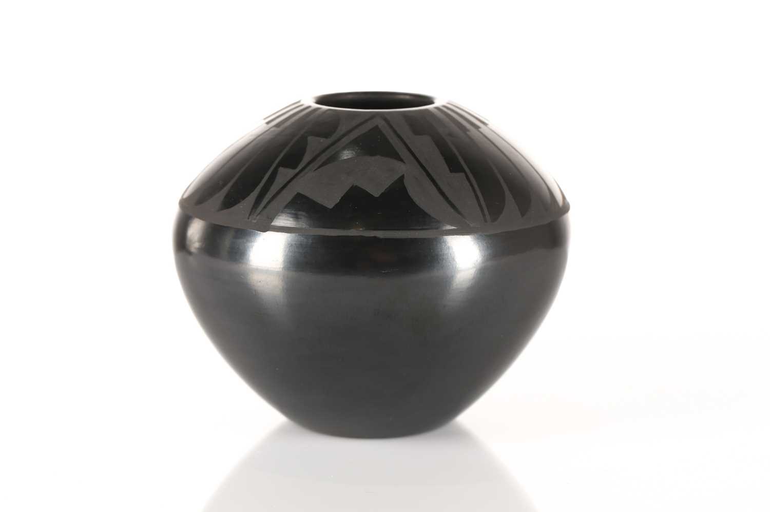 Lot 495 - A Santa Maria Pueblo blackware vase, by...