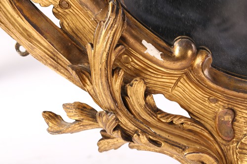 Lot 287 - A large oval carved wood and gilt gesso rococo...