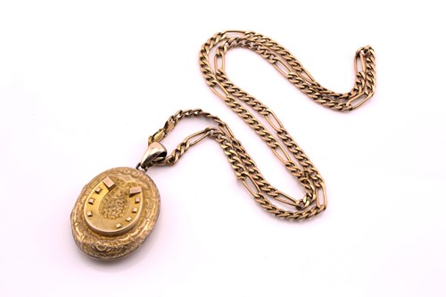 Lot 169 - A flat curb link chain and locket, consisting...