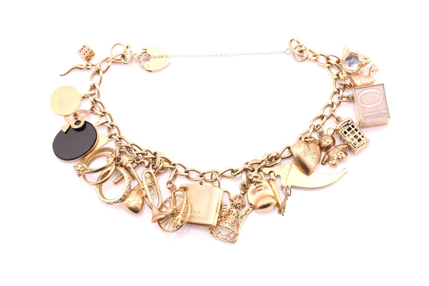 Lot 193 - A 9ct gold charm bracelet, the curb link chain...