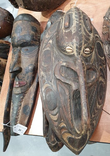 Lot 33 - A Sepik River hardwood house mask, Papua New...