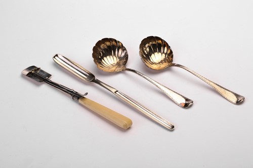 Lot 465 - A pair of George III silver sauce ladles, a...